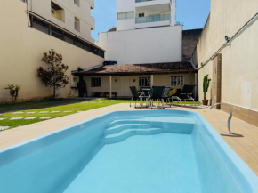 Casa de Praia com Piscina, quintal, lazer e churrasco, 3 quartos com ar condicionado, sendo 2 suites para sua familia!